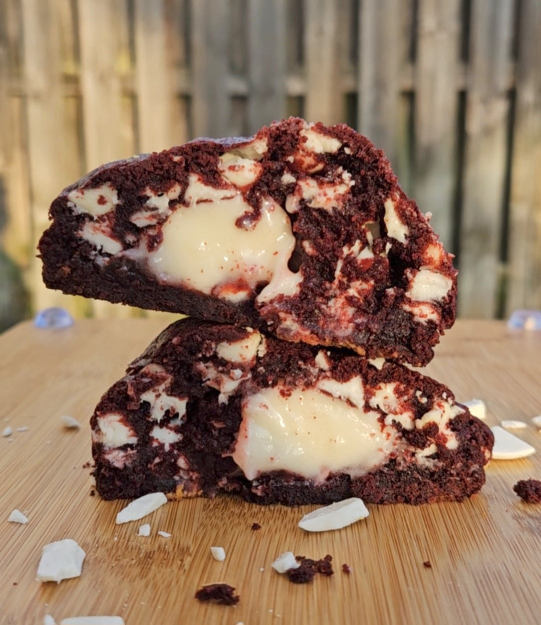 "Indulgent red velvet cookies with a soft, creamy cream cheese center, perfect for dessert lovers."
